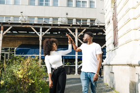 lady and man playing in greensboro neighborhood